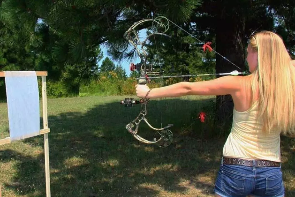 Using a paper target as a target, the shooters fire arrows and measure the results to determine the path the arrow is taking during paper tuning a bow