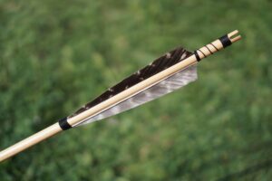 arrow fletching is a process involves attaching feathers or vanes to a particular sample using an arrow fletching jig